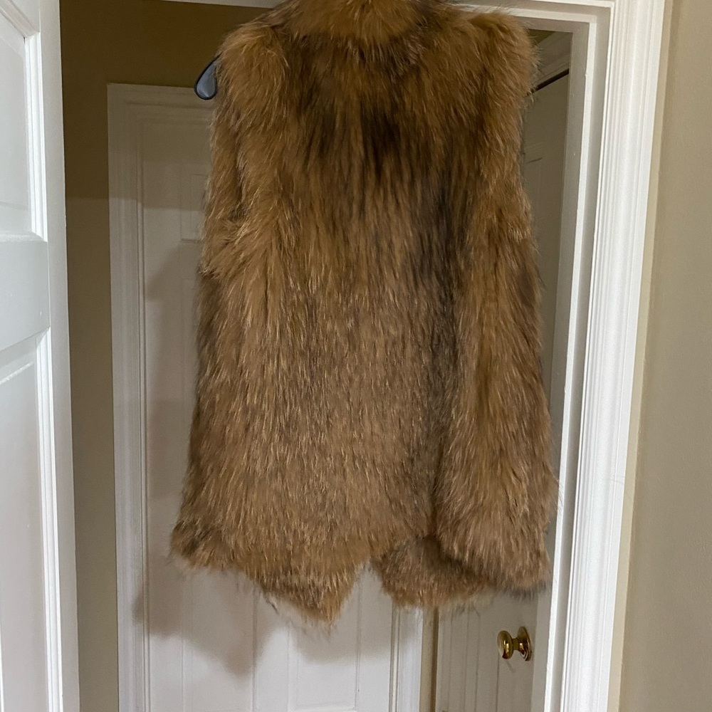 Fur jacket,light brown w/ side pockets.